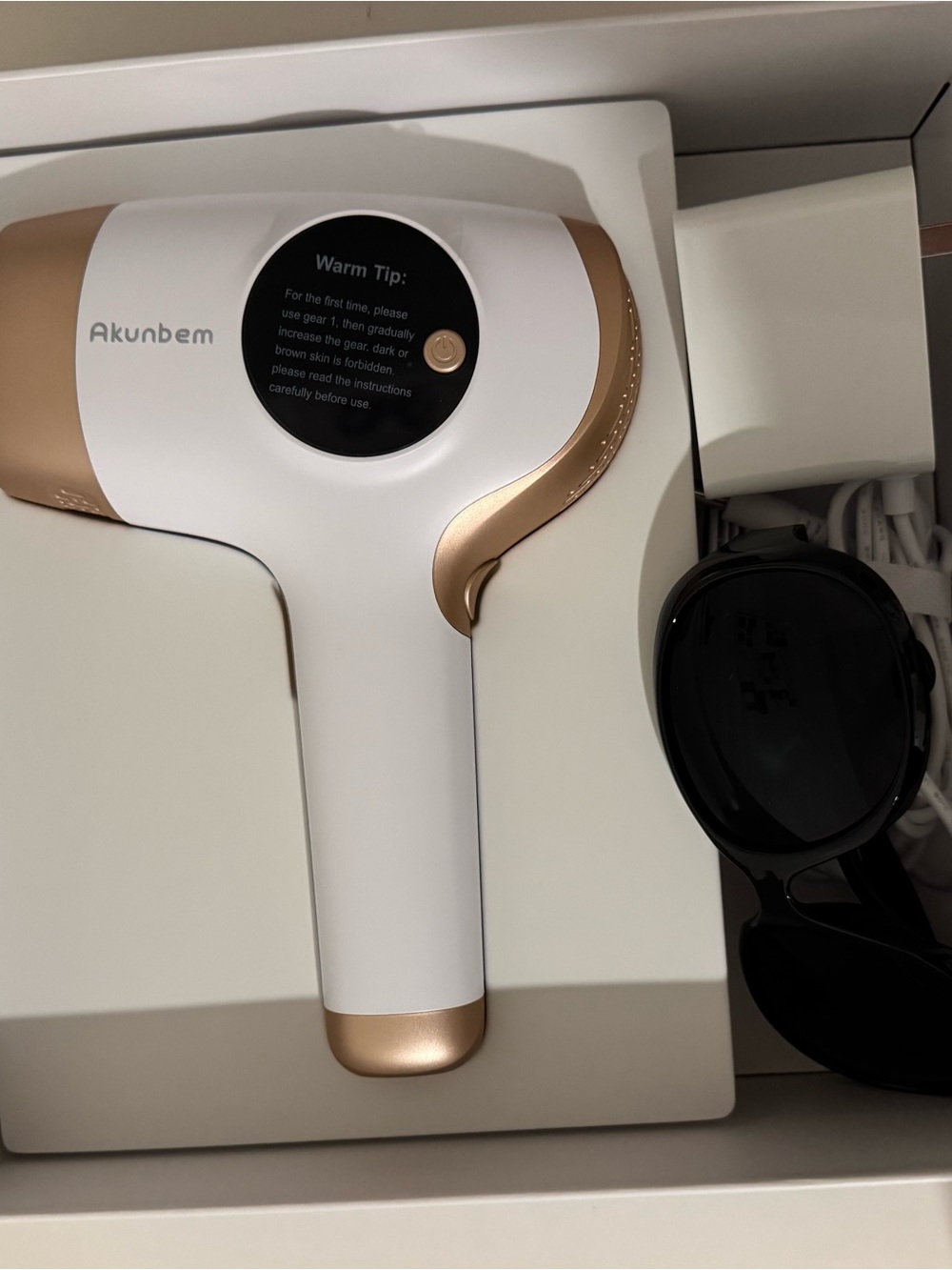 Akunbem White & Rose Gold Handheld Device
